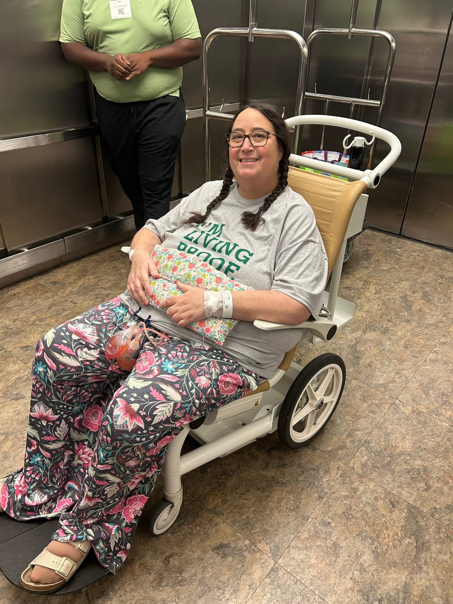 Melissa in wheelchair leaving the hospital.